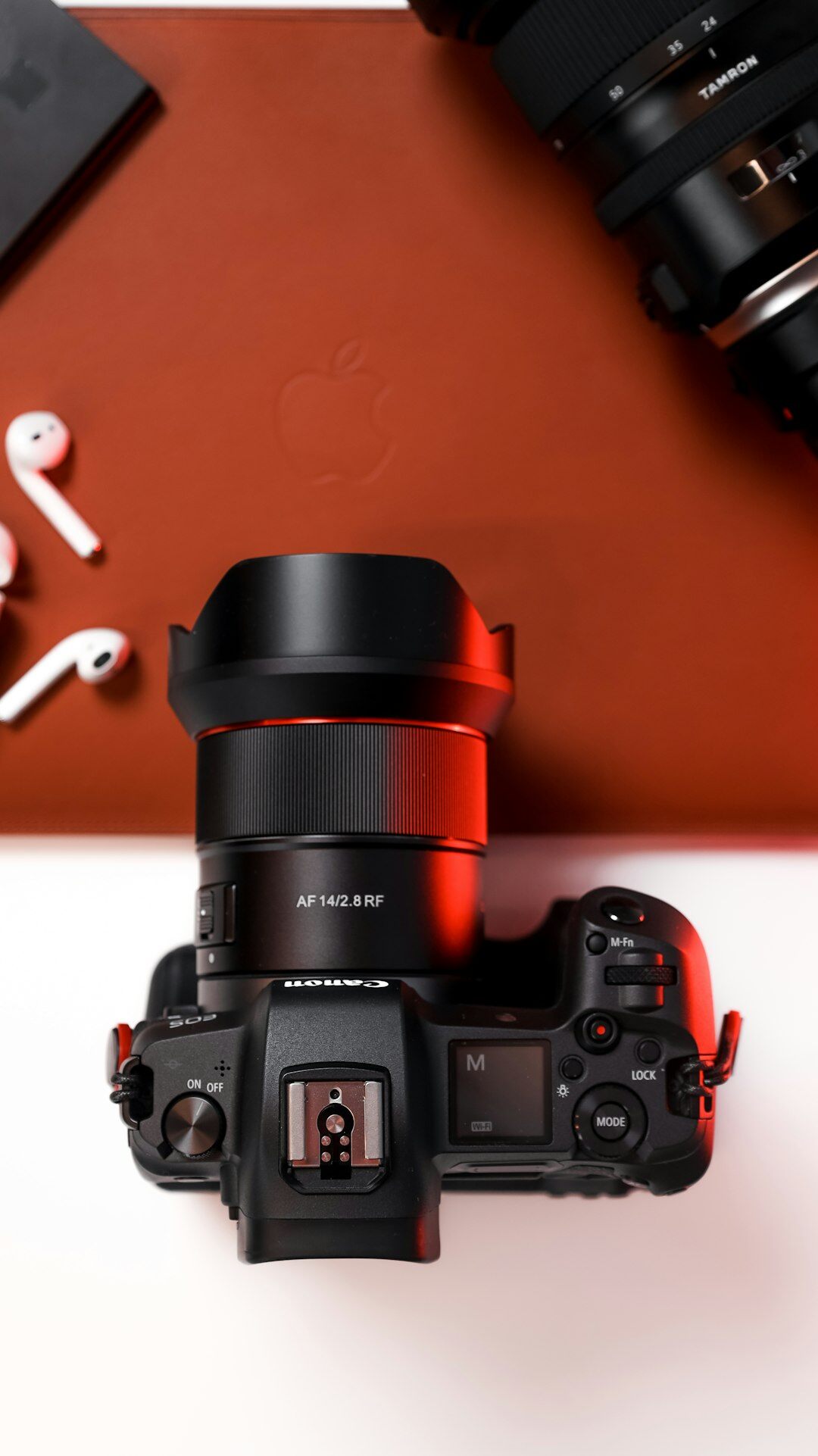 Professional camera and photography equipment on a studio desk