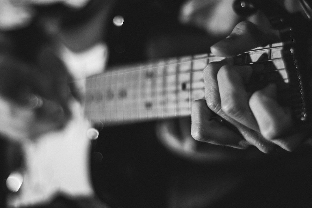 Portrait of a Uruguayan musician holding an acoustic guitar